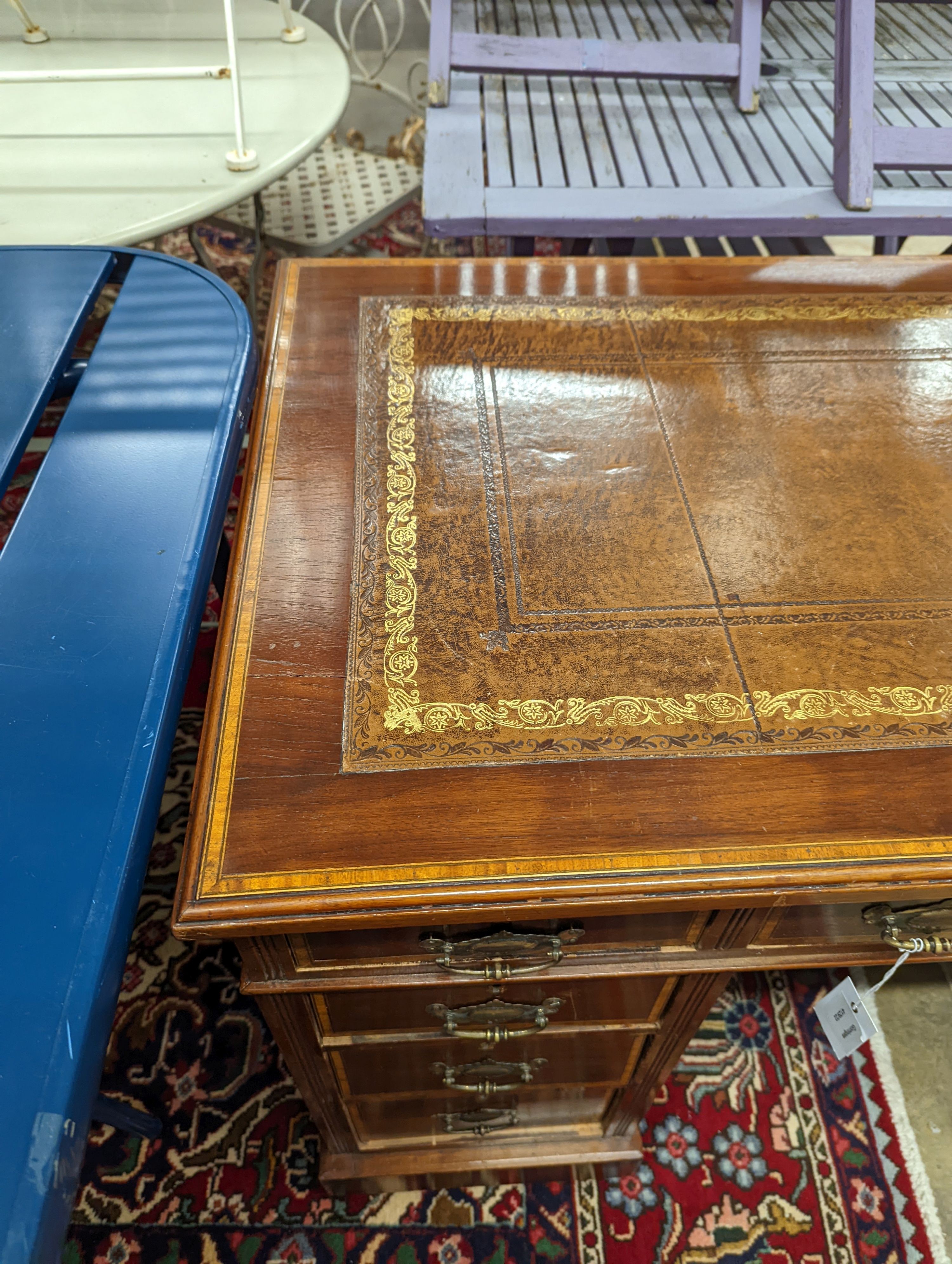 An Edwardian satinwood banded mahogany pedestal desk, length 106cm, depth 59cm, height 74cm
